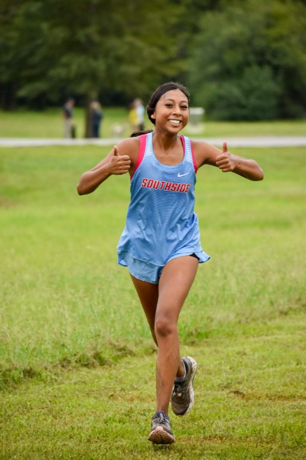 Judith Ramirez crosses the finish line at the cross country meet on September 12th. 