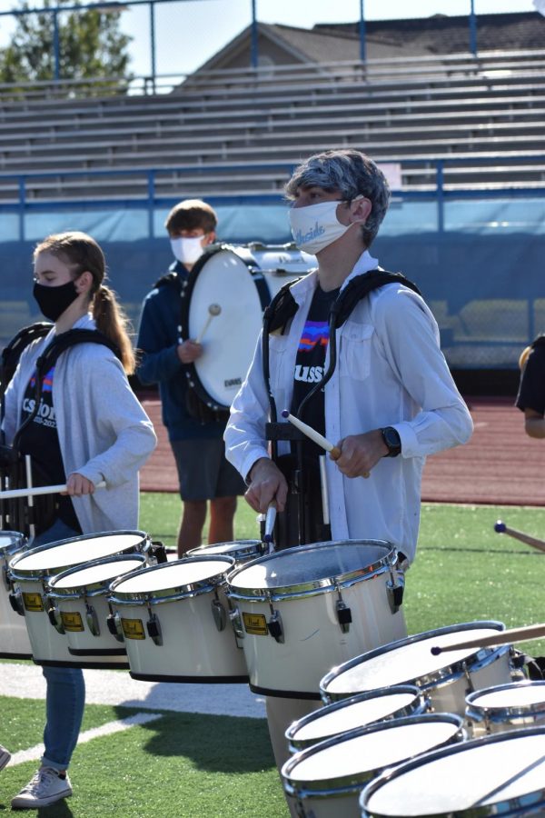 Jacob Weaver playing at the football homecoming pep rally.