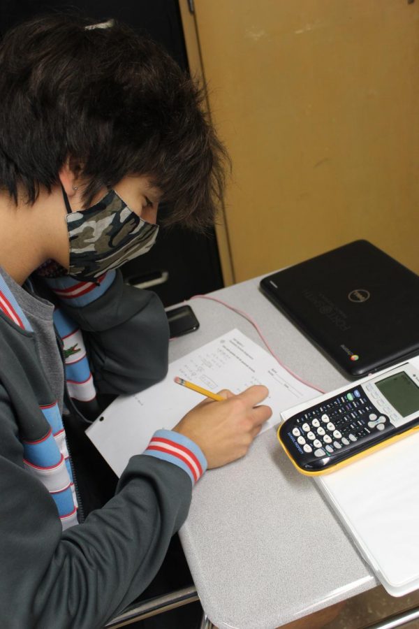 Isaac Teague working on math homework.