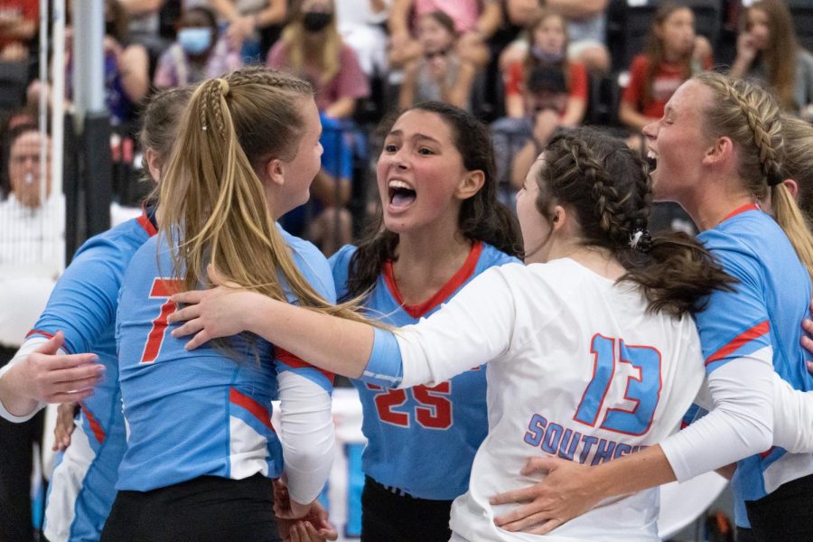 Playing on the varsity volleyball team, freshman Gabi Dupree celebrated a winning point with her teammates at the Northside vs. Southside game on Aug. 19. “It feels amazing, it was an awesome experience to play with older girls because they made me a much better player. It’s always fun to have a big cocmpetition between another good school. I think it’s important it stays that way because it really gets everybody excited. It’s very excitcing. I was a little nervous, it was my first high school volleyball game. But, it was awesome and I was so excited for the season to continue. It was so amazing all the student sections were awesome. My teammates were always encouraging me and getting me pumped up. The energy was out of this world,” freshman Gabi Dupree said.