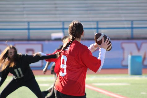 Powder Puff Chiefs quarterback looks for open players to move the ball down the field. Student council put on the annual Powder Puff football match to raise money for future school activities. 