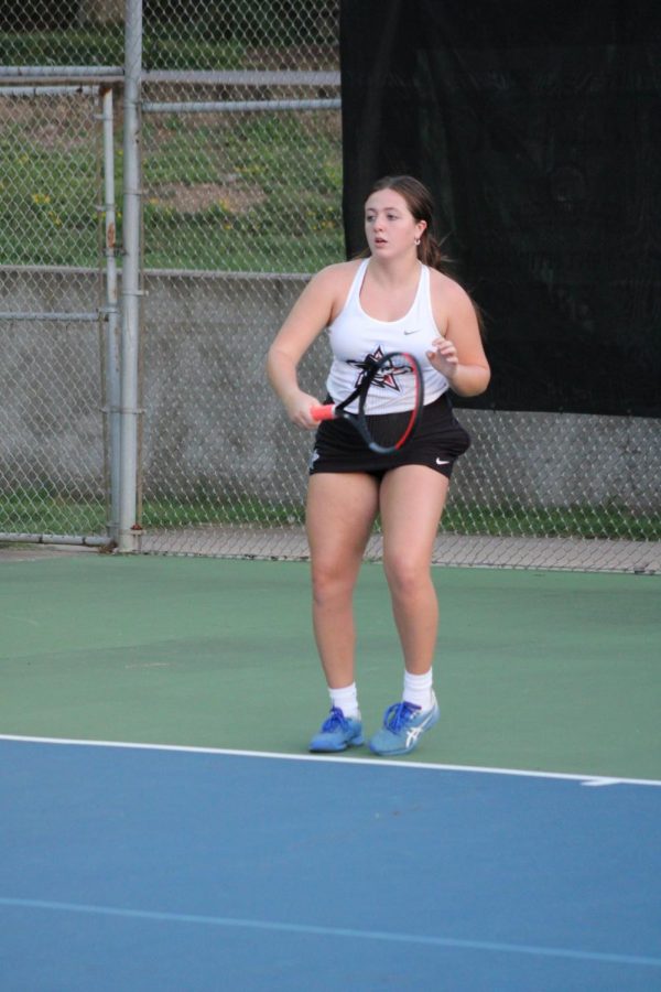 Annie Nelligan in position to play at tennis match against Northside
