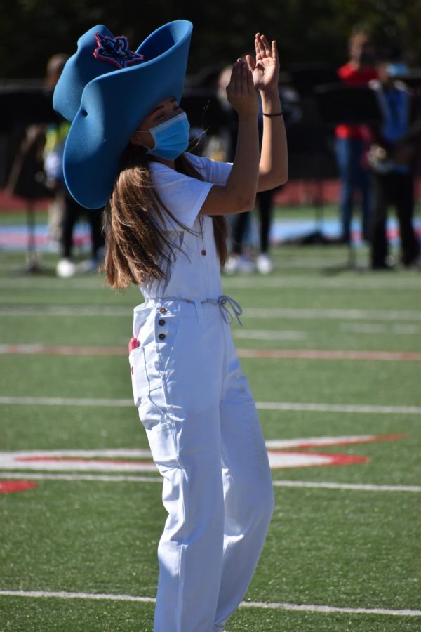 Marsha the Maverick (Emily Fincher) cheers on the crowd during the football homecoming pep rally.