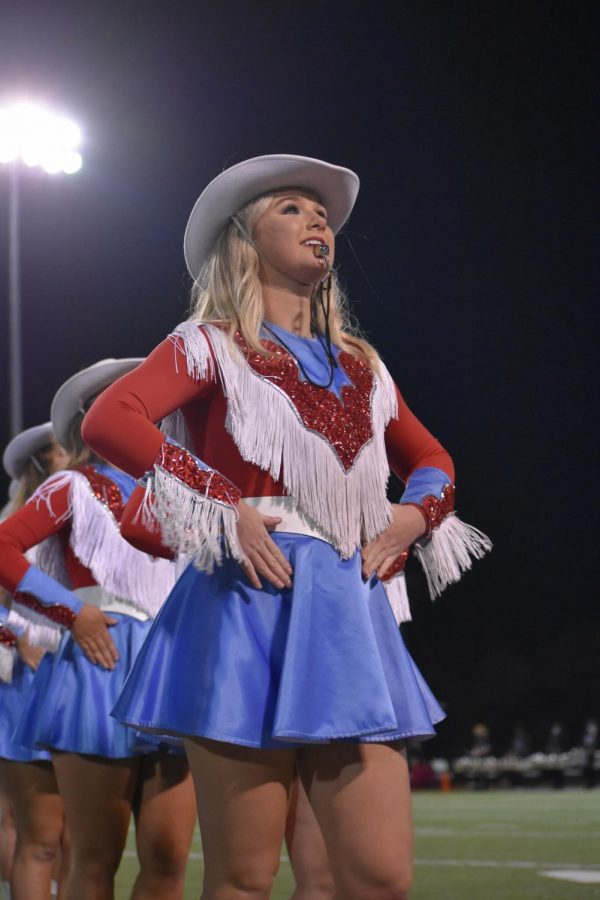 Captain Sara Remy leads the Southern Belles off the field.