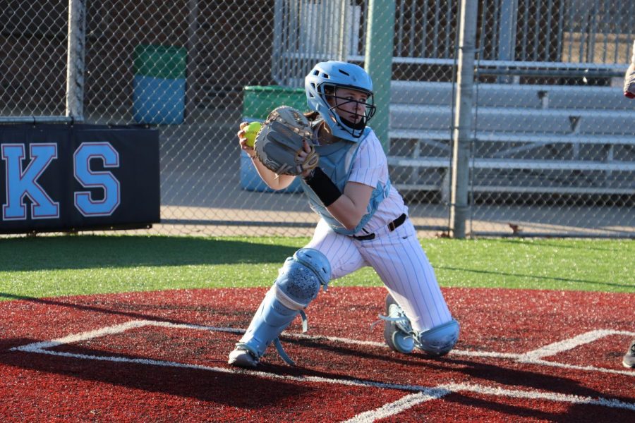 Madi Conklin catching at first home game.