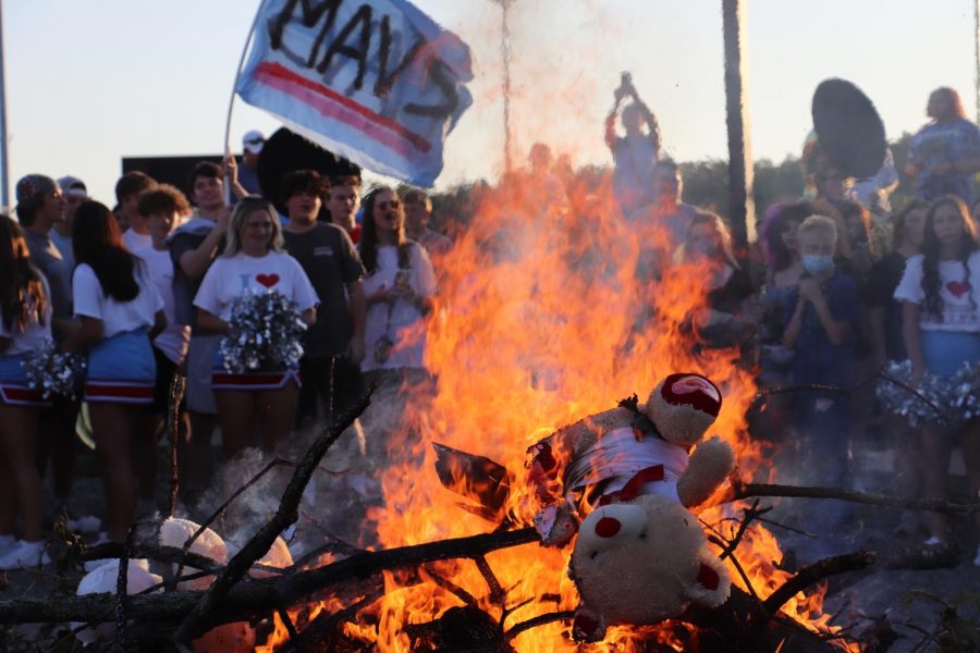 Stuffed bears burn at the Aug. 25 Bear-B-Que in the gravel stadium lot as a pre-event to the Northside rivalry game.