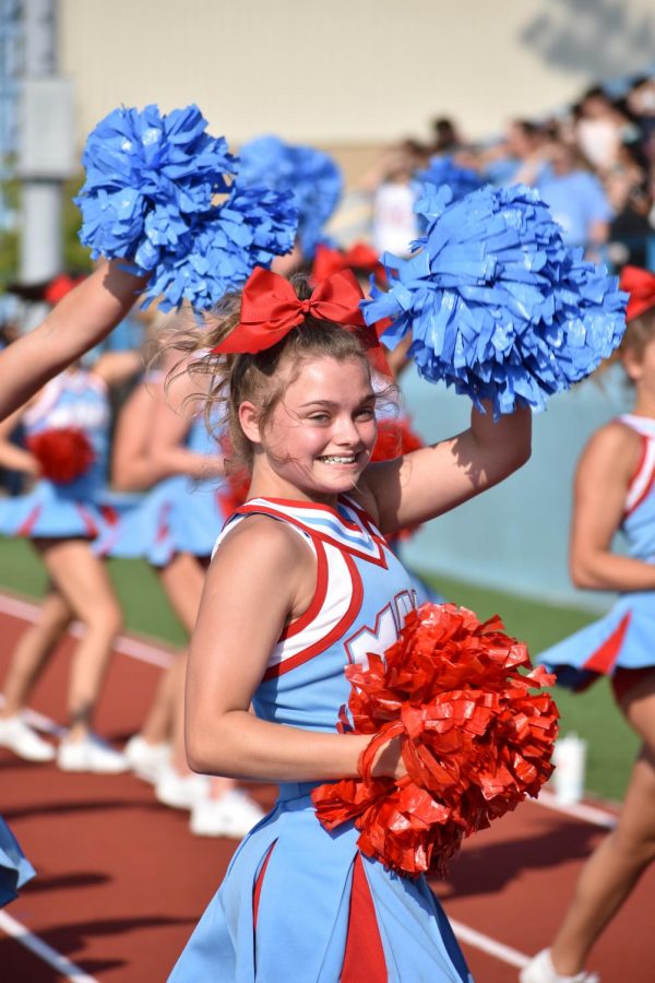 Cheer squad junior Madison Kinsey performs to Fat Gold Chain during the pep rally on Aug. 26.
