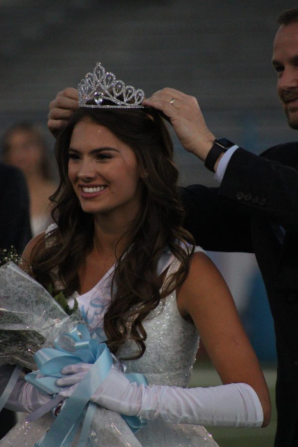 Senior Alexa Crowder is crowned Homecoming Queen by Principal Jeff Prewitt.